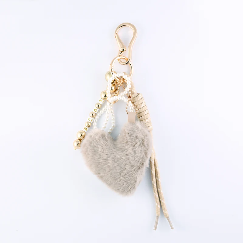 Bijoux de sac cœur beige en fausse fourrure